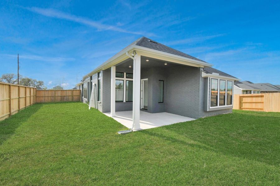 Exterior details and patio area of a home in Arabella on the Prairie: Signature Collection, Richmond (Image 18).