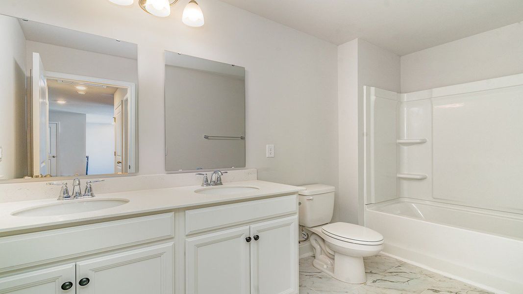 Representative furnished interior of a home built from the BELFORT by D.R. Horton in Belle Park, North Myrtle Beach (Image 6).