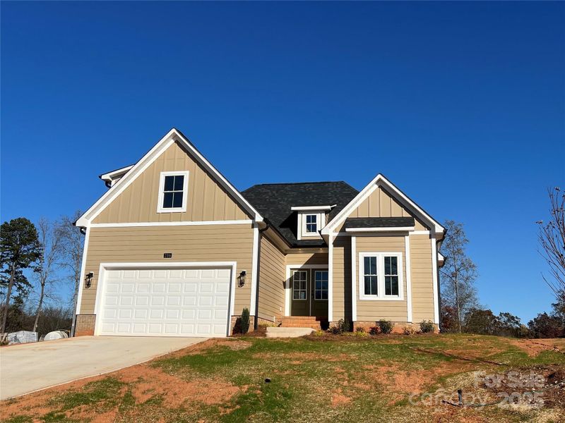 Front exterior of a new home in , China Grove, NC, highlighting curb appeal (Image 2).