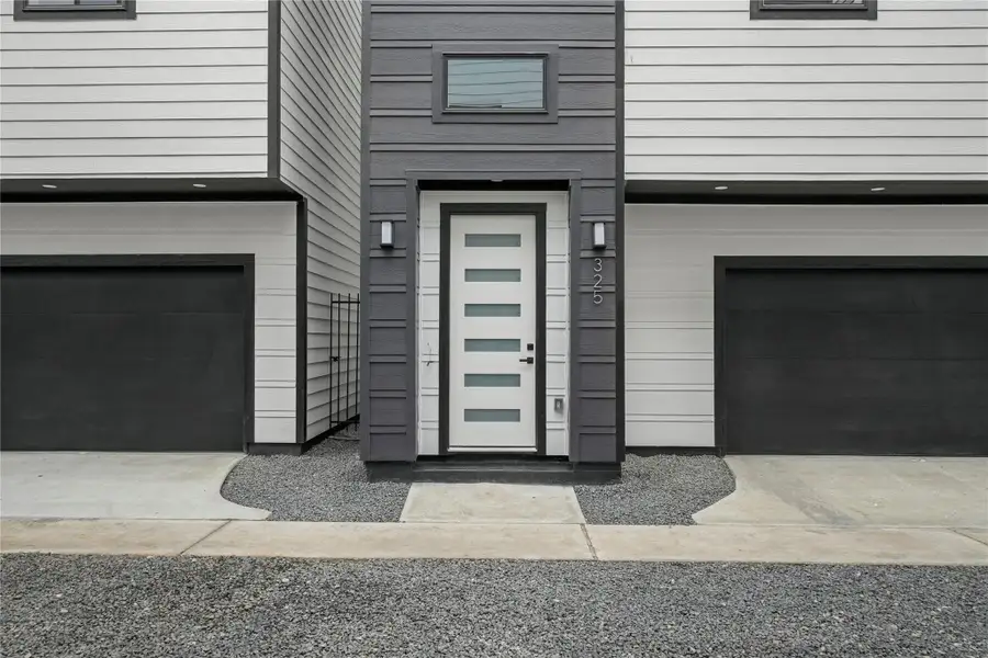 With modern finishes and fixtures inside and out, the front porch offers a welcoming entrance with an 8-foot glass paneled door with two coach lights. The smart garage has a MyQ app and a separate storage room.
