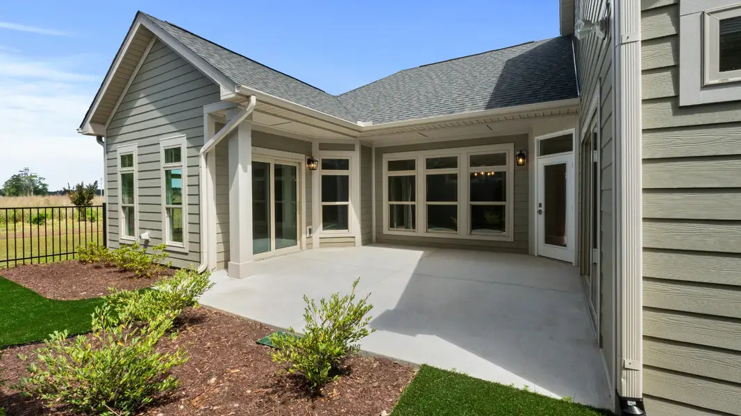 Exterior details and patio area of a home in Courtyards by Carrell, Ocean Isle Beach (Image 3). Exterior details and patio area of a home in Courtyards by Carrell, Ocean Isle Beach (Image 3).