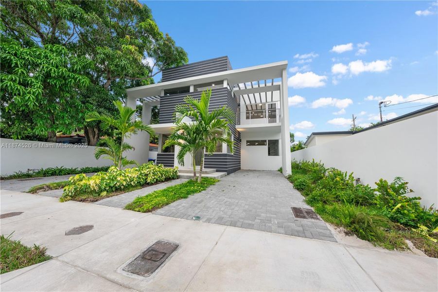 Front exterior of a new home in , Miami, FL, highlighting curb appeal (Image 2).