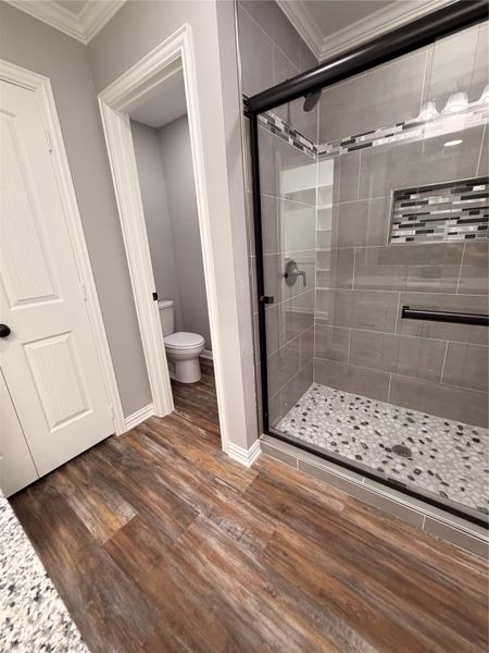 Shower with separate water closet.