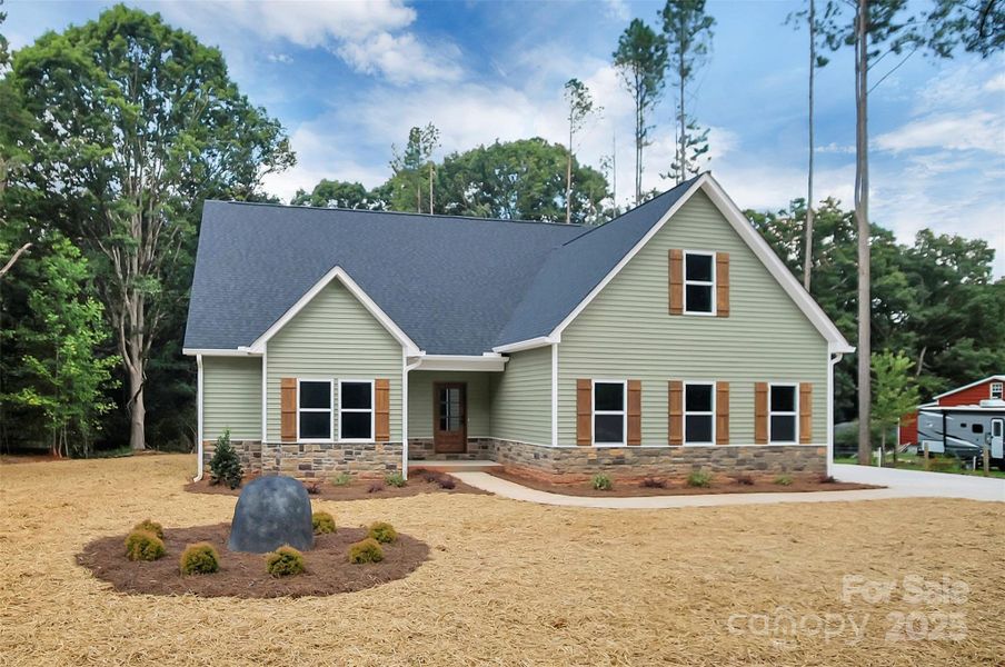 Front exterior of a new home in , Iron Station, NC, highlighting curb appeal (Image 24).