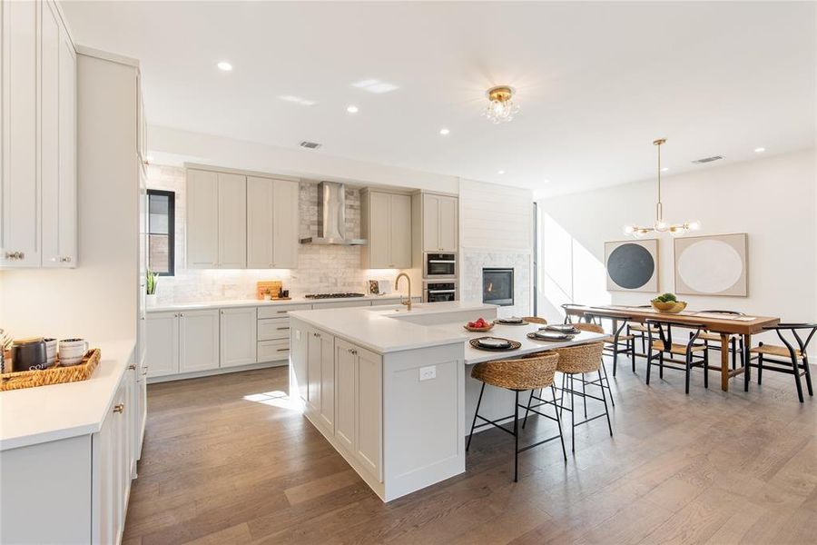 The kitchen is a joy magnet that will make it hard to leave! With the fireplace offset, that area can be formal dining, or a cozy family flex area. Builder happy to swap out light fixture if buyer wants another living area, as opposed to dining.