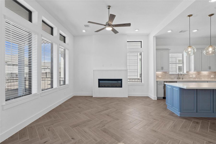 The highlight of this gorgeous Great Room is the fireplace, providing a safe, low-maintenance, and eco-friendly alternative to traditional wood-burning or gas units.