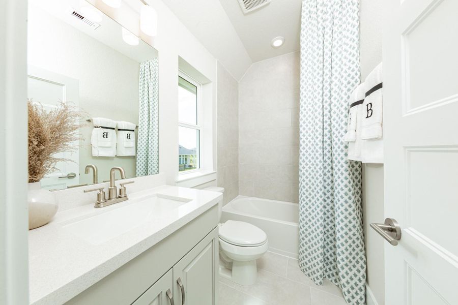 Secondary bathroom. Representative model home photos shown for illustrative purposes only. Actual home, features, and finishes may vary. Home is currently under construction.