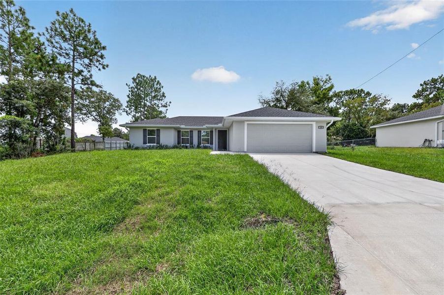 Front exterior of a new home in , Ocala, FL, highlighting curb appeal (Image 19).