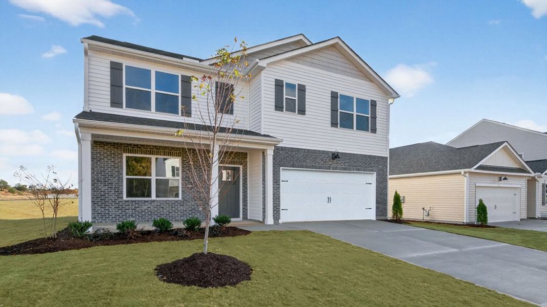 Front exterior of a new home in Honeycutt Oaks, Angier, NC, highlighting curb appeal (Image 2).