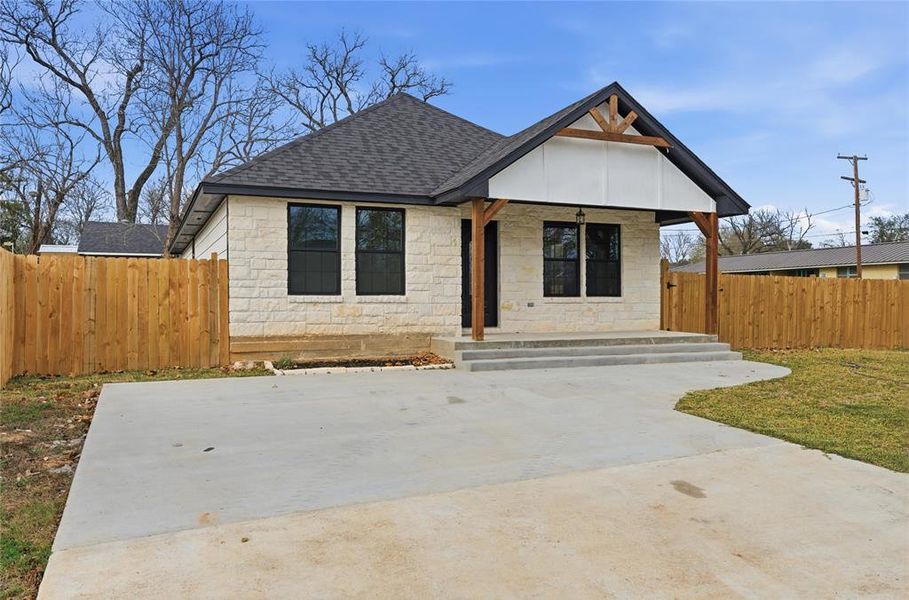 Front exterior of a new home in , Hearne, TX, highlighting curb appeal (Image 11).
