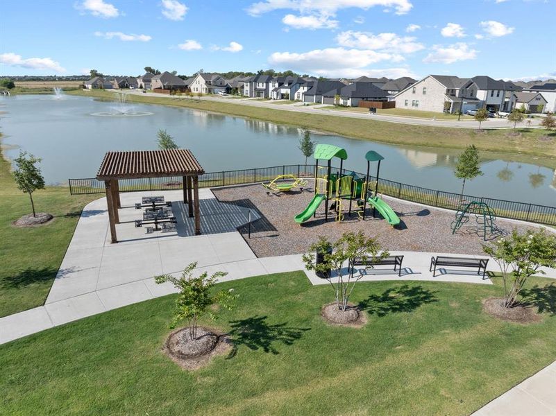 Surrounding community featuring a patio area, a water view, and a residential view Surrounding community featuring a patio area, a water view, and a residential view