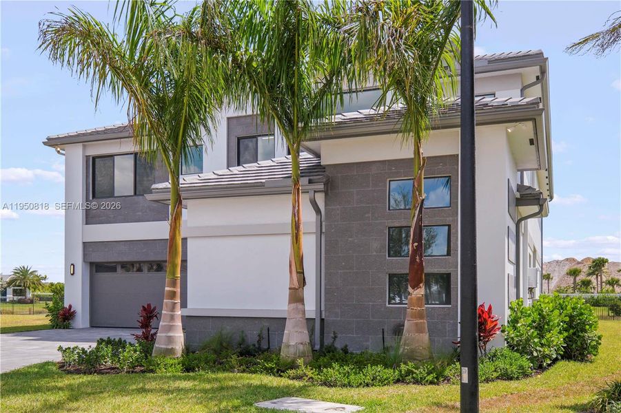 Front exterior of a new home in , Palm Beach Gardens, FL, highlighting curb appeal (Image 25). Front exterior of a new home in , Palm Beach Gardens, FL, highlighting curb appeal (Image 25).