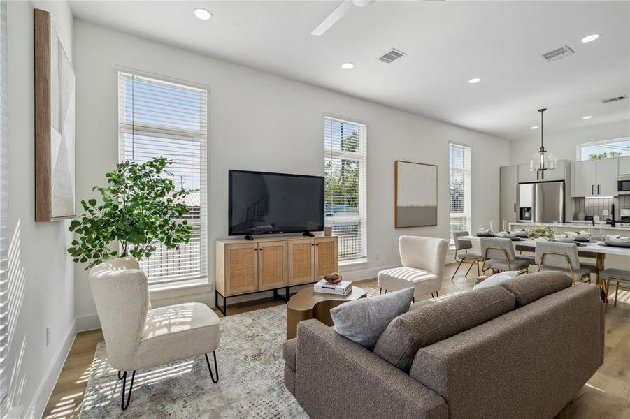 Another view of this open floor plan that overlooks the dining into the stunning kitchen design.