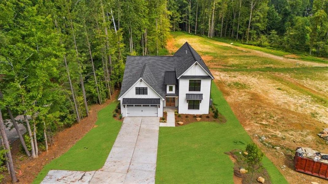Front exterior of a new home in , Sugar Hill, GA, highlighting curb appeal (Image 20). Front exterior of a new home in , Sugar Hill, GA, highlighting curb appeal (Image 20).