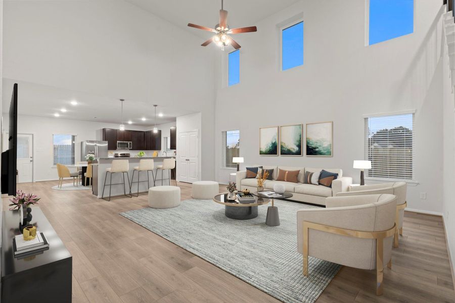 Virtually staged to show its full potential, the family room is truly the heart of the home. Soaring ceilings, tall windows, and abundant natural light enhance the spacious atmosphere, perfect for entertaining or relaxing in style.  This is what I call the Wow Factor!