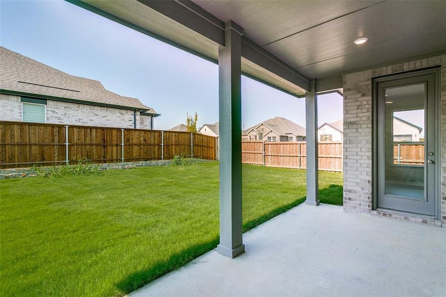 Exterior details and patio area of a home in The Preserve Estates, Justin (Image 18).
