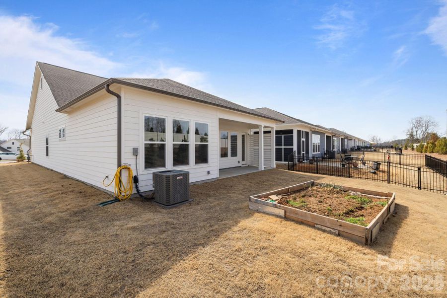 Exterior details and patio area of a home in Encore at Streamside - Classic Series, Waxhaw (Image 24).