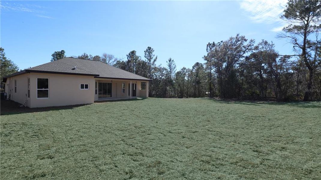 Exterior details and patio area of a home in , Brooksville (Image 3).