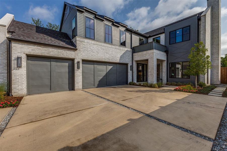Modern architectural exterior featuring light-colored brick and dark siding accents Modern architectural exterior featuring light-colored brick and dark siding accents