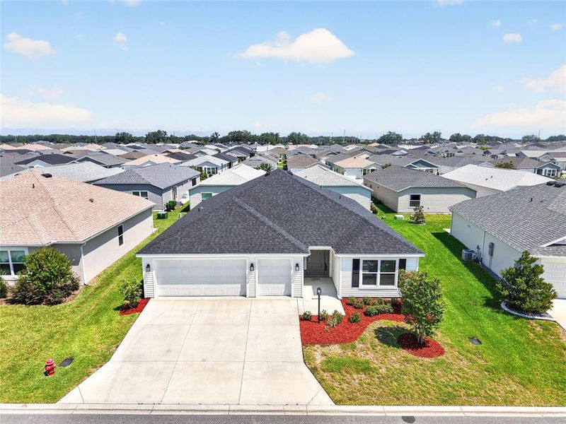 Front exterior of a new home in , The Villages, FL, highlighting curb appeal (Image 27).