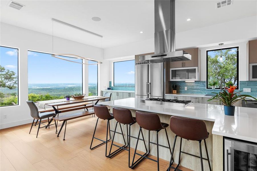 Kitchen and dining space with killer views of Travis and Hill Country