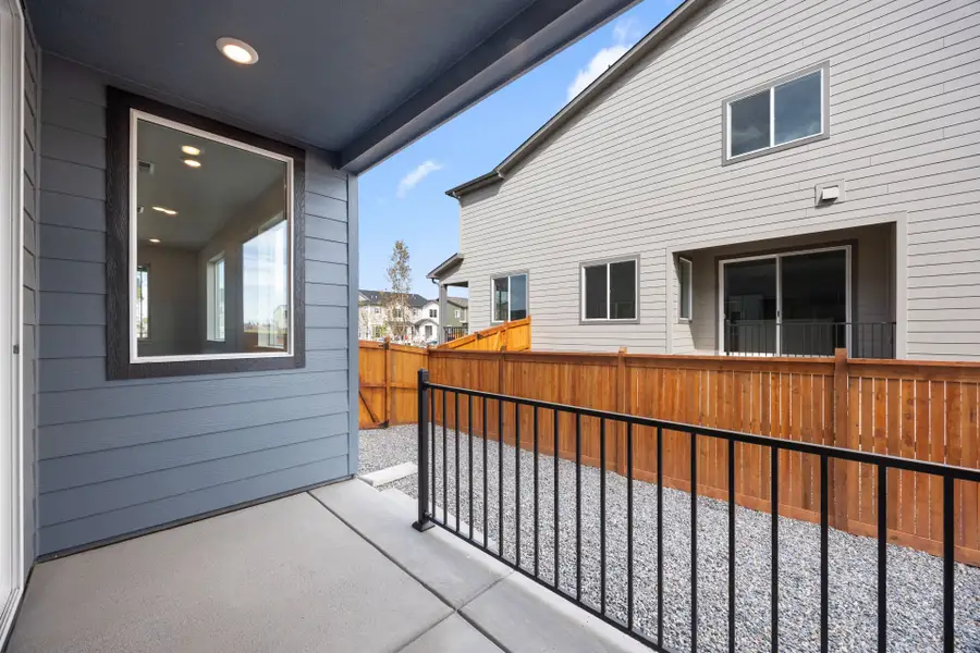 Exterior details and patio area of a home in Sky Ranch, Watkins (Image 29).