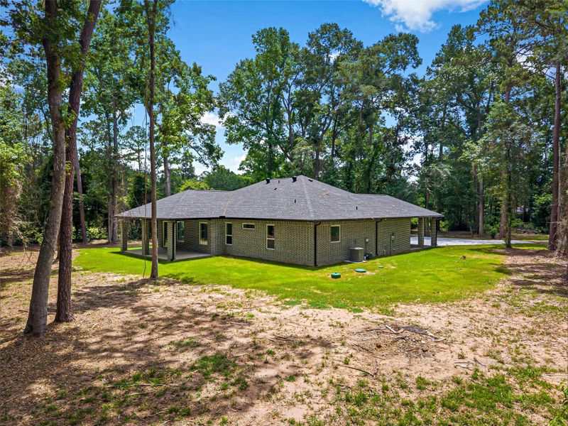 Exterior details and patio area of a home in , Splendora (Image 30).