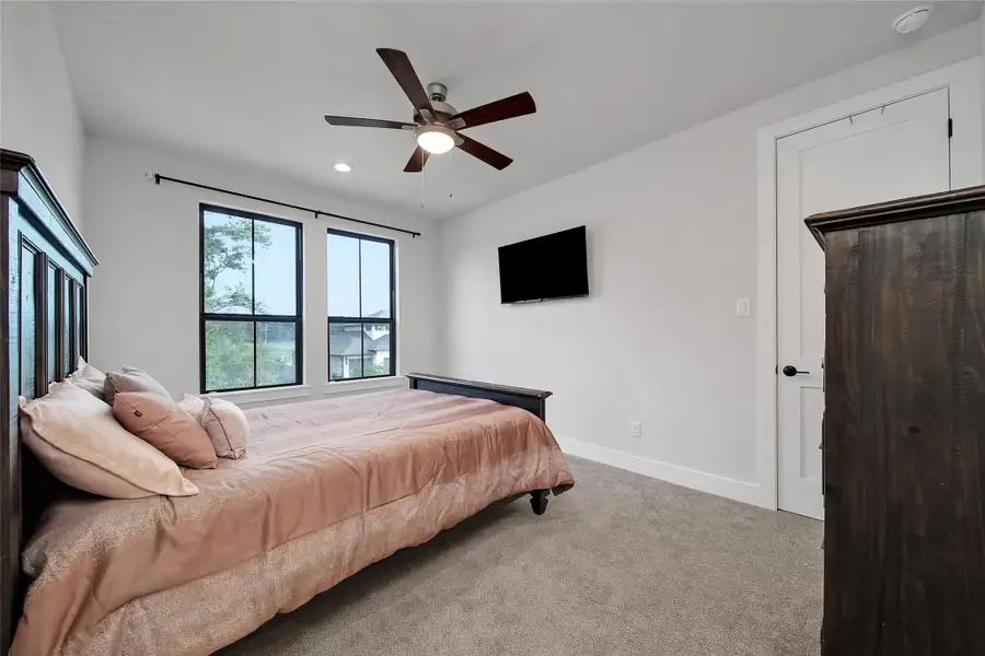 Furnished interior view inside a new home in ARTAVIA, Conroe (Image 43).