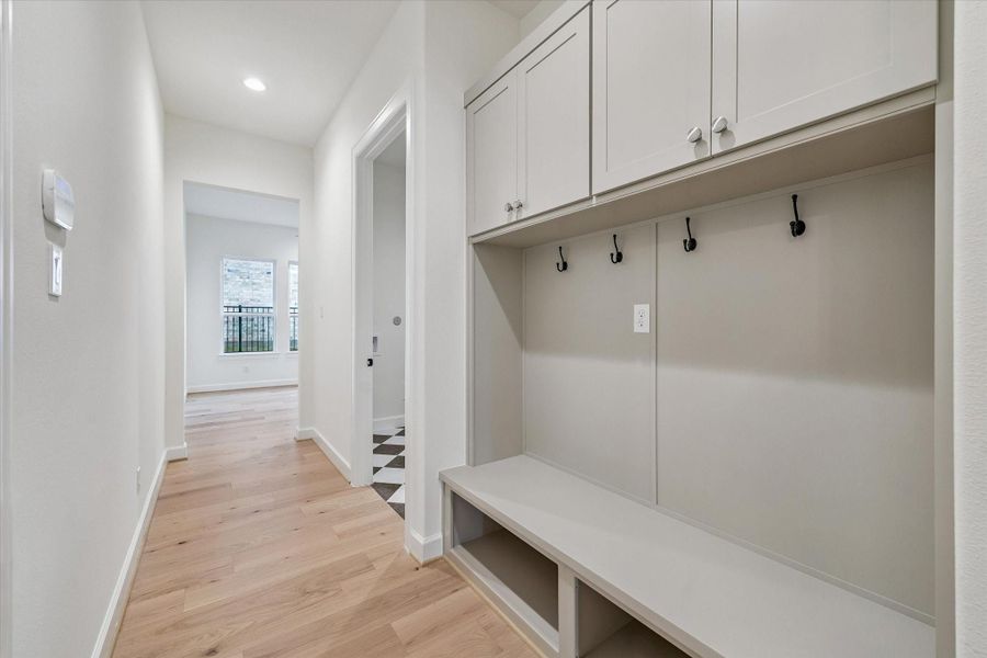 Mud Nook, Utility, Flex Room, and access to 3-Car Garage found off Hallway.