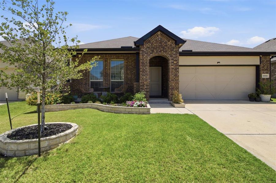 Front exterior of a new home in Kings Ridge, Denton, TX, highlighting curb appeal (Image 2). Front exterior of a new home in Kings Ridge, Denton, TX, highlighting curb appeal (Image 2).
