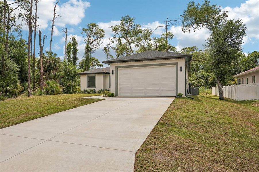 Front exterior of a new home in , Port Charlotte, FL, highlighting curb appeal (Image 19).