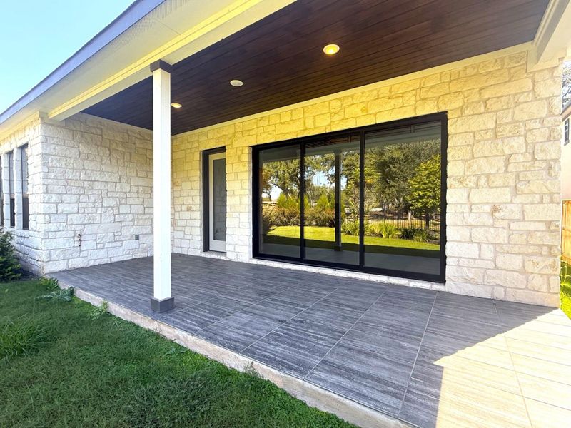 Exterior details and patio area of a home in Parmer Ranch, Georgetown (Image 4).