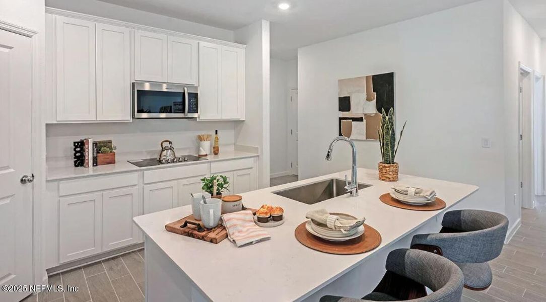 Furnished interior view inside a new home in Edenbrooke at Hyland Trail | 55+: Edenbrooke at Hyland Trail 50s, Green Cove Springs (Image 9).