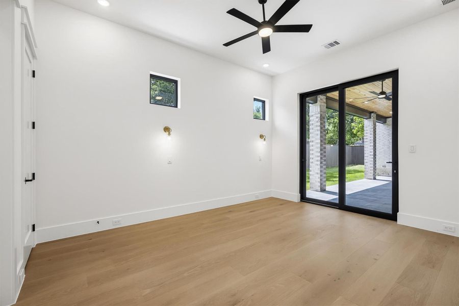 Featuring a downstairs guest suite with sliding doors leading to your oversized covered patio.