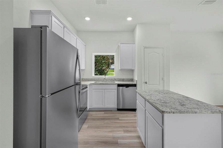 Furnished interior view inside a new home in Tula Parc, Astatula (Image 8).