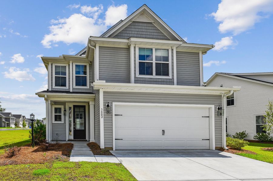 Front exterior of a new home in Windsor Crossing, North Charleston, SC, highlighting curb appeal (Image 23). Front exterior of a new home in Windsor Crossing, North Charleston, SC, highlighting curb appeal (Image 23).