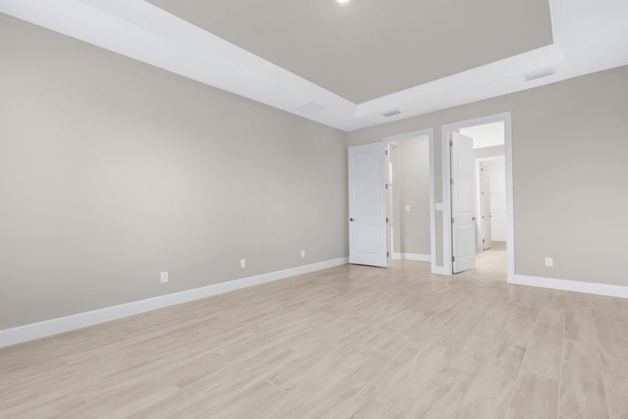 Spacious, unfurnished interior of a new home in Esplanade at Starling, Punta Gorda (Image 20).