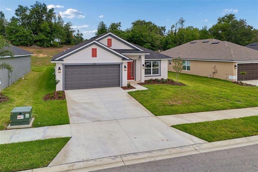 Front exterior of a new home in Abbey Glen, Dade City, FL, highlighting curb appeal (Image 31).