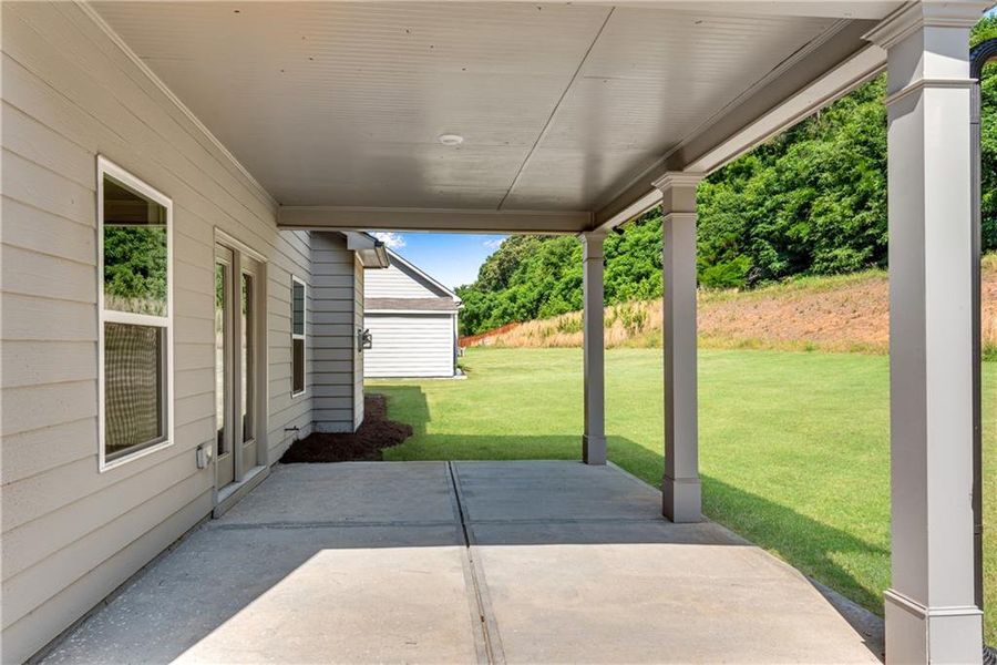 Exterior details and patio area of a home in Hidden Fields, Hoschton (Image 25).