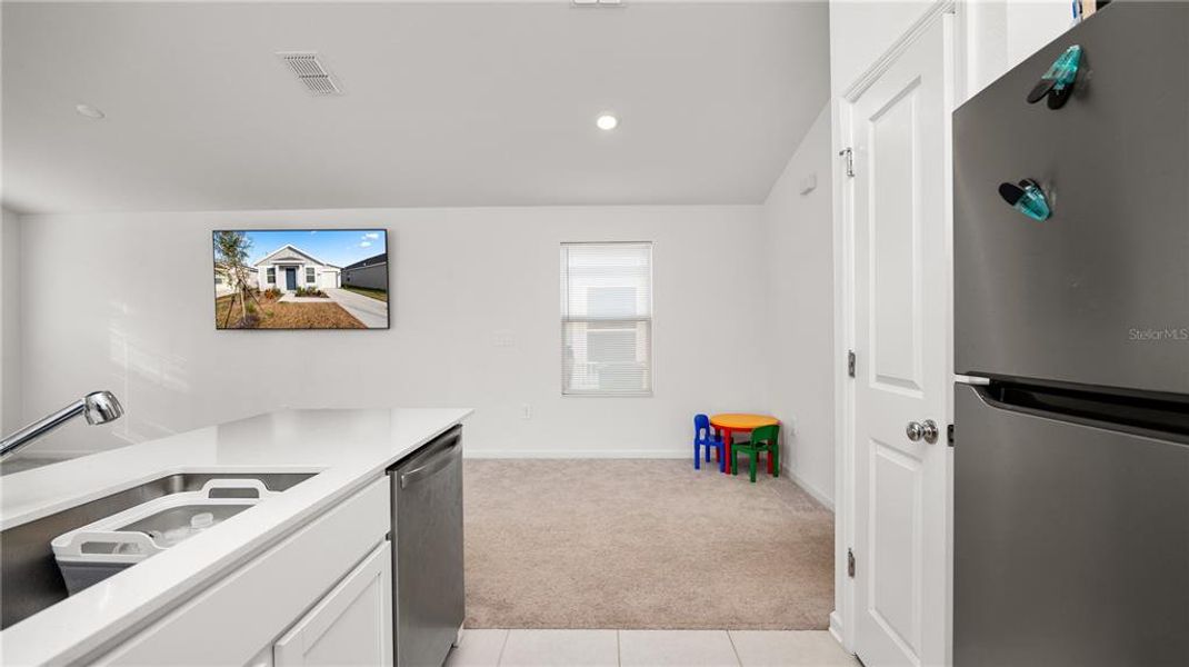Furnished interior view inside a new home in Peace Creek Reserve: Legacy Collection, Winter Haven (Image 6).