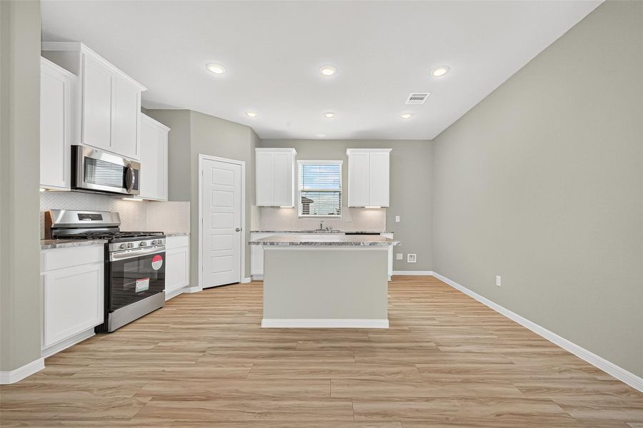 Furnished interior view inside a new home in Sunterra, Katy (Image 18).