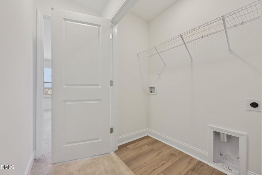 Hallway laundry area Hallway laundry area