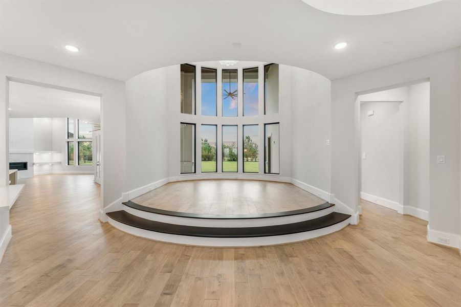 -- Representational Photo -- Sensational elevated 2-story living room with gorgeous stacked windows makes a statement as you enter the grand foyer.