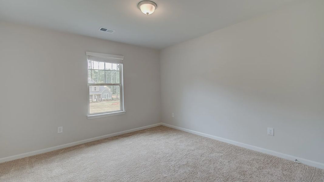 Representative furnished interior of a home built from the Meridian II by DRB Homes in Northcroft, Loganville (Image 24).