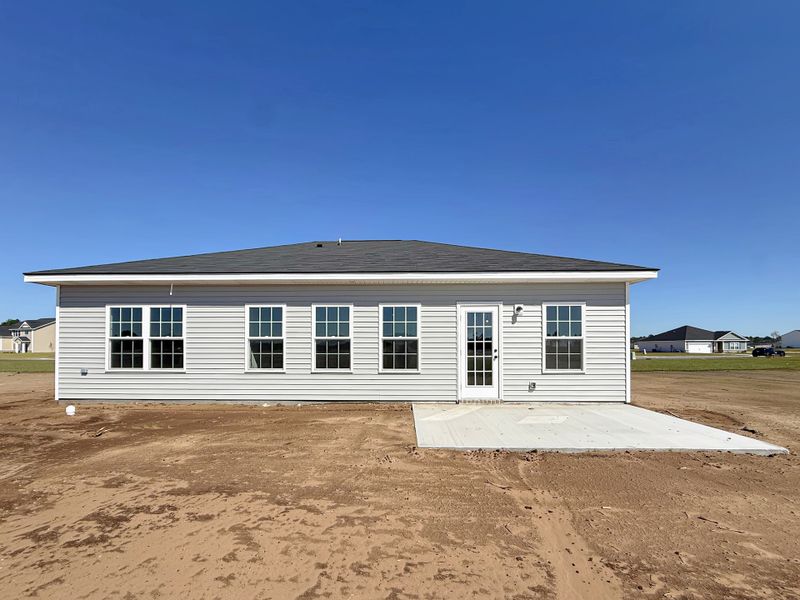Exterior details and patio area of a home in The Village at Sassafras, Allenhurst (Image 2).