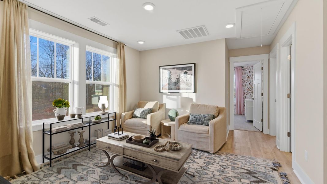 Vibrant loft of the Lawson floorplan offering flexibility as a study nook, game room, or second family space in Greenville