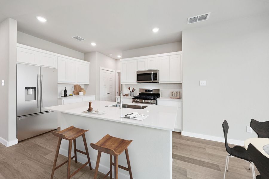 Kitchen in the Mesquite home plan by Trophy Signature Homes – REPRESENTATIVE PHOTO