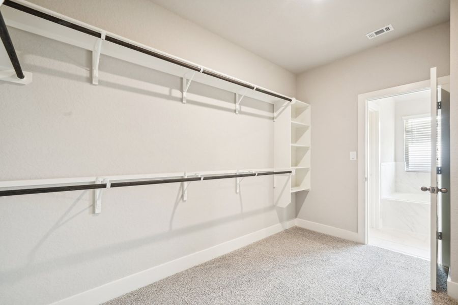 Primary walk-in closet in the Preston floorplan at a Meritage Homes community.