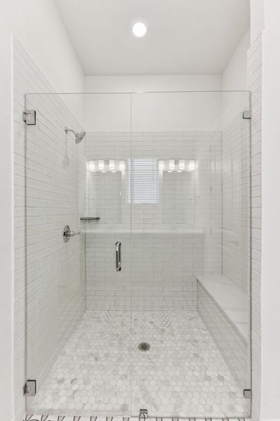 Bathroom with a stall shower and recessed lighting Bathroom with a stall shower and recessed lighting