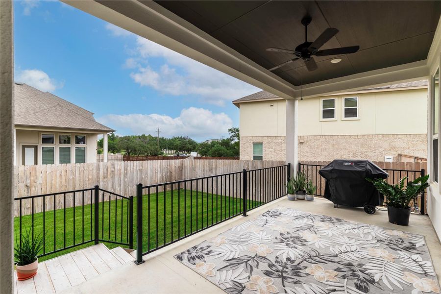 View of patio featuring ceiling fan, grilling area, and fence private yard